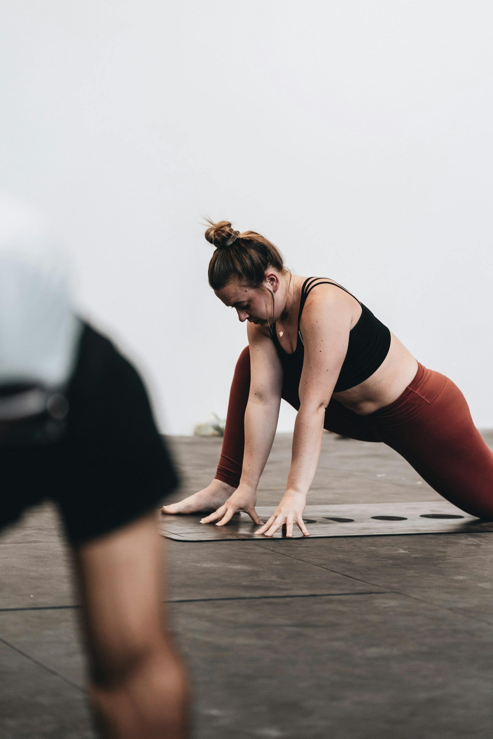 Member stretching on a mat